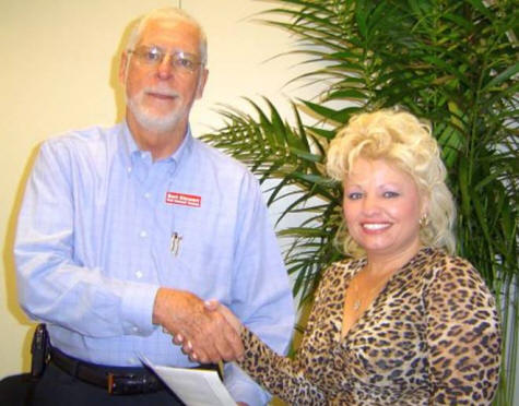 Laura receives $1,000 check